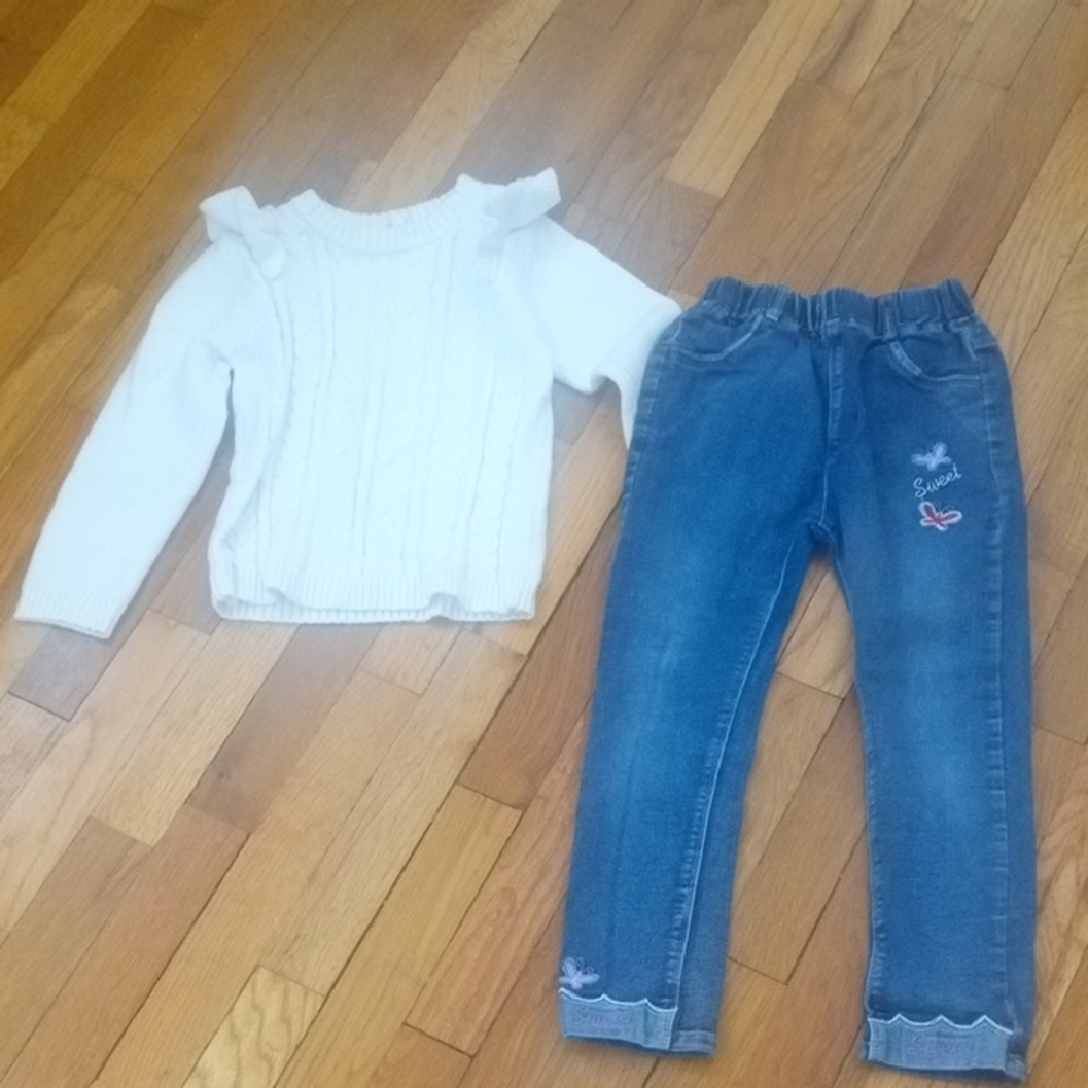 White Ruffled Sweater and jeans with stitched accents, girl 6